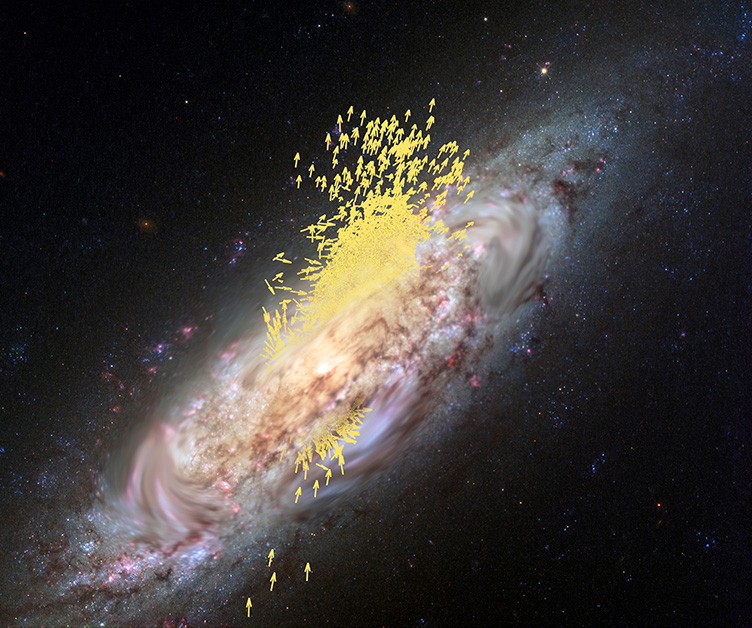La imagen muestra el remolino de una galaxia espiral con un montón de pequeñas flechas amarillas agrupadas alrededor de su centro. Las flechas apuntan en varias direcciones.
