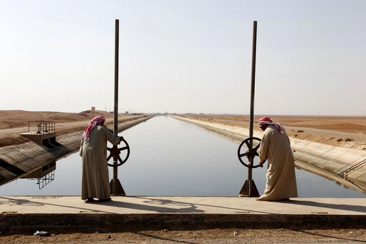 A canal stemming from the Euphrates river in Syria during a drought.