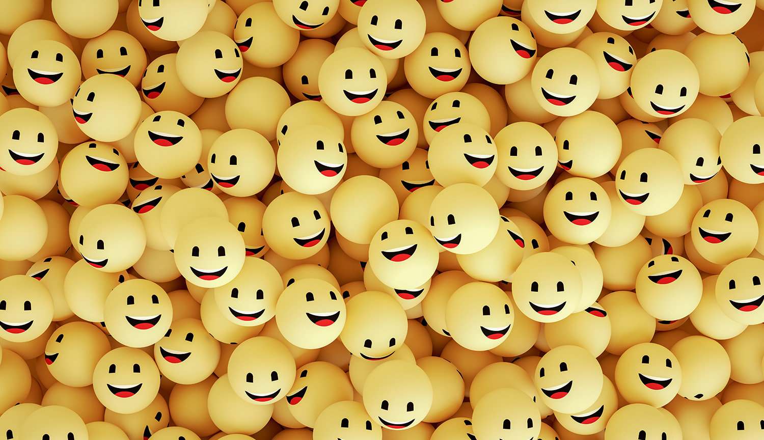 Un conjunto de bolas amarillas que tienen caras felices.